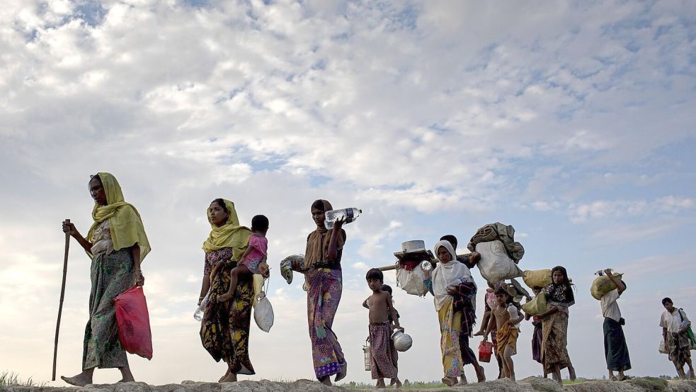 Flüchtende Rohingya aus Myanmar: Drangsaliert und teilweise zwangsrekrutiert. Foto: Km Asad/ZUMA/dpa